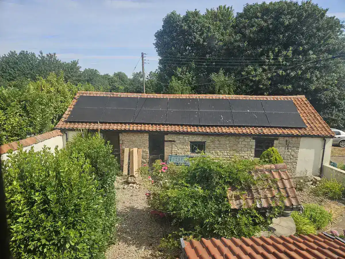 Additional solar array installed on the roof of an outbuilding at an anonymised residential property